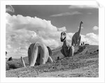 1950s dinosaur park south dakota three dinosaur statues on hillside by Anonymous
