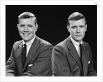 1950s double exposure of man with a smile and a frown wearing a suit by Anonymous