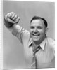 1940s 1950s portrait of man in shirt and tie holding handkerchief smiling by Anonymous