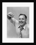 1940s 1950s portrait of man in shirt and tie holding handkerchief smiling by Anonymous