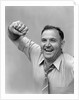 1940s 1950s portrait of man in shirt and tie holding handkerchief smiling by Anonymous