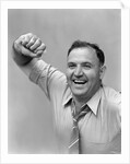 1940s 1950s portrait of man in shirt and tie holding handkerchief smiling by Anonymous