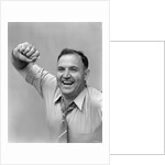1940s 1950s portrait of man in shirt and tie holding handkerchief smiling by Anonymous