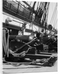 1930s row of cannon breeches on gun deck of sailing naval ship of war by Anonymous