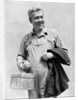 1930s man in overalls work uniform holding thermos lunchbox and jacket by Anonymous