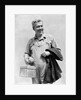 1930s man in overalls work uniform holding thermos lunchbox and jacket by Anonymous