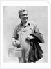 1930s man in overalls work uniform holding thermos lunchbox and jacket by Anonymous