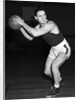 1930s teen boy playing basketball holding ball standing in position by Anonymous