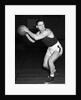 1930s teen boy playing basketball holding ball standing in position by Anonymous