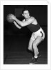 1930s teen boy playing basketball holding ball standing in position by Anonymous