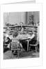 1950s 4 pre-school age children seated at small round table putting together jigsaw puzzle by Anonymous
