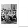 1950s 4 pre-school age children seated at small round table putting together jigsaw puzzle by Anonymous