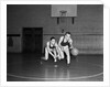 1930s two boys playing basketball inside court dribbling basketball by Anonymous