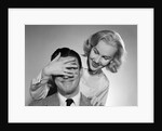 1950s woman standing behind man with hand over his eyes by Anonymous