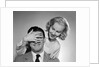 1950s woman standing behind man with hand over his eyes by Anonymous