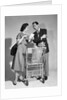 1950s couple man woman shopping cart reviewing grocery list man has cigar in hand by Anonymous