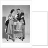 1950s couple man woman shopping cart reviewing grocery list man has cigar in hand by Anonymous