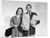 1950s couple smiling woman man carrying grocery bags smoking cigar looking at camera by Anonymous
