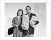 1950s couple smiling woman man carrying grocery bags smoking cigar looking at camera by Anonymous