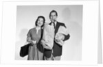 1950s couple smiling woman man carrying grocery bags smoking cigar looking at camera by Anonymous