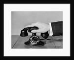 1930s 1940s man's hand on telephone by Anonymous