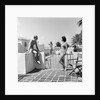 1930s man woman wearing bathing suits on terrace overlooking swimming pool woman on diving board by Anonymous