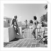1930s man woman wearing bathing suits on terrace overlooking swimming pool woman on diving board by Anonymous