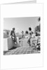 1930s man woman wearing bathing suits on terrace overlooking swimming pool woman on diving board by Anonymous
