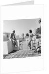 1930s man woman wearing bathing suits on terrace overlooking swimming pool woman on diving board by Anonymous