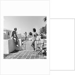 1930s man woman wearing bathing suits on terrace overlooking swimming pool woman on diving board by Anonymous