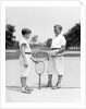 1920s 1930s two boys tennis match holding rackets measuring net height by Anonymous
