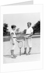 1920s 1930s two boys tennis match holding rackets measuring net height by Anonymous