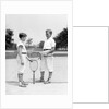 1920s 1930s two boys tennis match holding rackets measuring net height by Anonymous