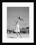 1930s woman playing tennis about to hit ball with racket by Anonymous