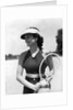 1930s woman in polka dot halter top shorts & sun visor holding a tennis ball & racket by Anonymous