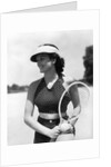 1930s woman in polka dot halter top shorts & sun visor holding a tennis ball & racket by Anonymous