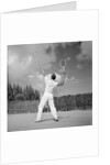 1930s back view of man playing tennis about to hit the ball summer outdoor by Anonymous