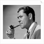 1950s frowning businessman in jacket and tie smoking a pipe by Anonymous