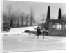 1920s couple man woman ice skating on outdoor rink with car nearby skating side by side by Anonymous