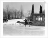 1920s couple man woman ice skating on outdoor rink with car nearby skating side by side by Anonymous