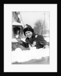 1920s 1930s smiling boy about to throw toss snowball playing snow fun winter cold mischief looking at camera by Anonymous
