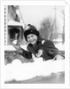 1920s 1930s smiling boy about to throw toss snowball playing snow fun winter cold mischief looking at camera by Anonymous