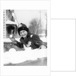 1920s 1930s smiling boy about to throw toss snowball playing snow fun winter cold mischief looking at camera by Anonymous