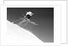 1950s man skier skiing down slope jumping into air by Anonymous