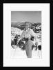 1940s 1950s young blond athletic woman looking at camera smiling standing with ski poles top of mountain by Anonymous