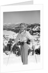 1940s 1950s young blond athletic woman looking at camera smiling standing with ski poles top of mountain by Anonymous