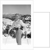 1940s 1950s young blond athletic woman looking at camera smiling standing with ski poles top of mountain by Anonymous