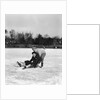1920s 1930s two smiling boys looking at camera ice skating one boy fallen other picking him up by Anonymous