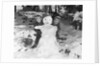 1950s 1960s smiling boy and girl building a snowman together in snowy woods by Anonymous