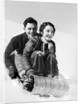 1920s 1930s smiling couple man and woman on toboggan in winter by Anonymous